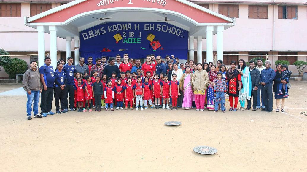 Mario Arques and Sergio Cidoncha enjoy a game of football with the students of DBMS Football School.