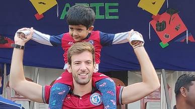 Mario Arques and Sergio Cidoncha enjoy a game of football with the students of DBMS Football School.