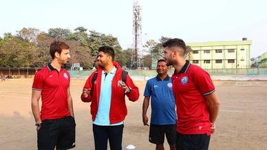 Mario Arques and Sergio Cidoncha enjoy a game of football with the students of DBMS Football School.