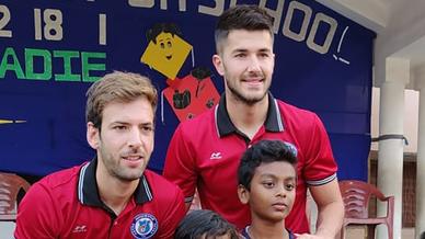 Mario Arques and Sergio Cidoncha enjoy a game of football with the students of DBMS Football School.