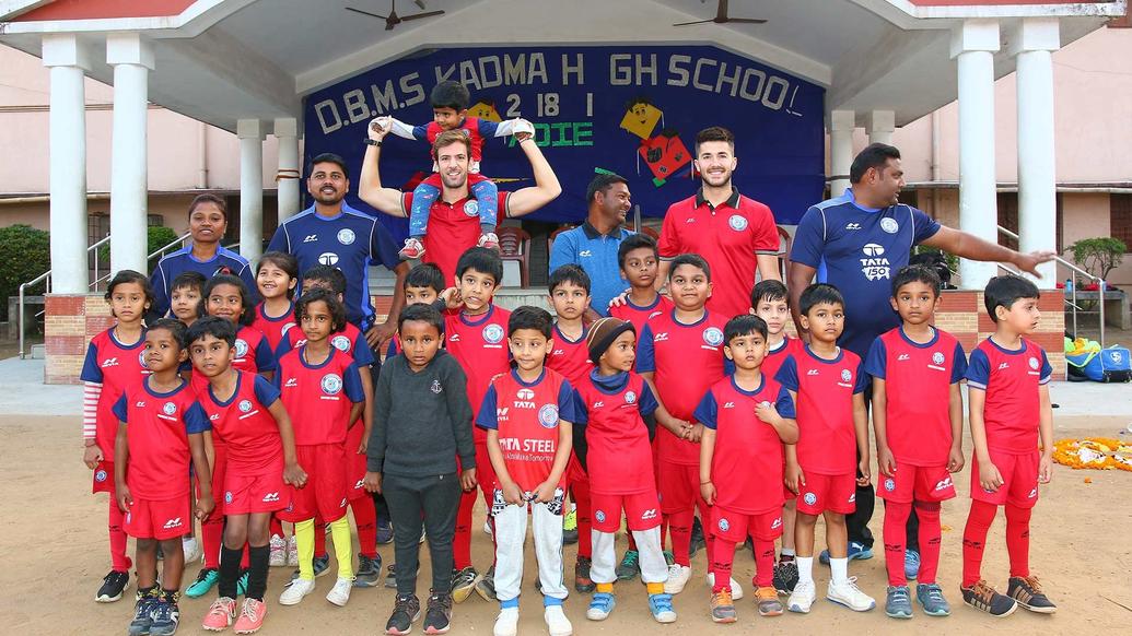 Mario Arques and Sergio Cidoncha enjoy a game of football with the students of DBMS Football School.