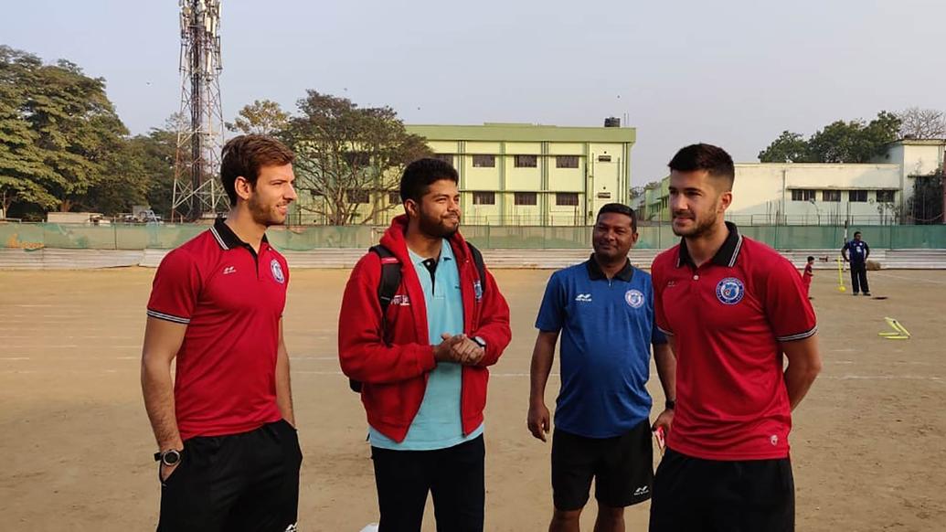 Mario Arques and Sergio Cidoncha enjoy a game of football with the students of DBMS Football School.