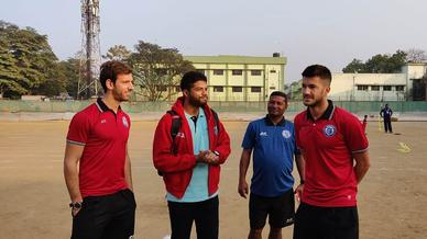 Mario Arques and Sergio Cidoncha enjoy a game of football with the students of DBMS Football School.