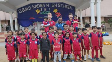 Mario Arques and Sergio Cidoncha enjoy a game of football with the students of DBMS Football School.